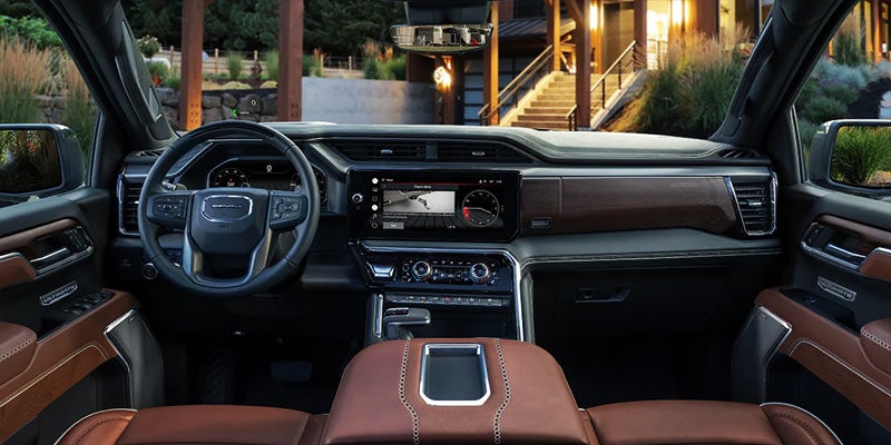 Front deck of Sierra truck which is parked front of house